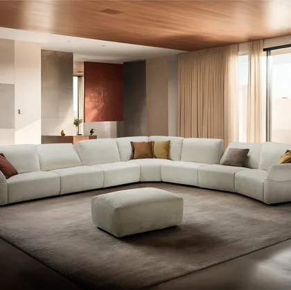 Divano angolare in tessuto Carrera di Franco Ferri